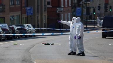 Forensic officers inside a police cordon in Nottingham on the day of the attacks in June 2023. 