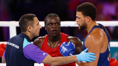 Aziz Abdul reacts after being disqualified for a headbutt during fight against England's Damar Thomas