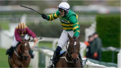 Paul Townend celebrates winning the 2024 Grand National at Aintree with I Am Maximus