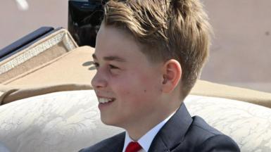 Prince George, head and shoulders, in a carriage at Trooping the Colour, June 2026