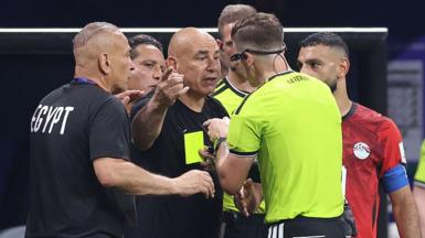 Egypt head coach Hossam Hassan complains to referee