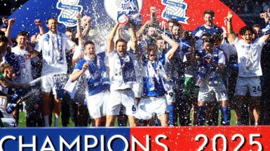 Birmingham's squad celebrate with the League One trophy.