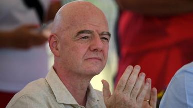 Gianni Infantino applauds during a ceremony in Colombia