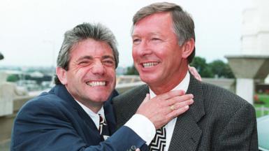 Kevin Keegan jokingly puts his right hand up to a smiling Sir Alex Ferguson's neck