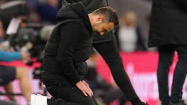 Roberto De Zerbi slumps to his knees during Tottenham Hotspur's draw at home to Leeds United.