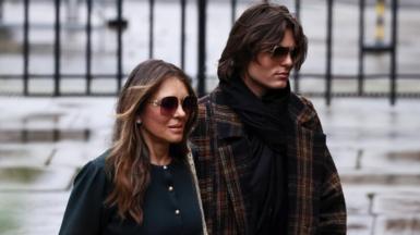 Actor Liz Hurley with her son Damian Hurley, arriving at court. Both wear sunglasses and have neutral expressions.