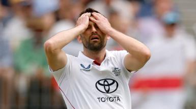 Mark Wood reacts during England's first Ashes Test in Perth