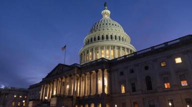 The US Capitol lit up in the twilight