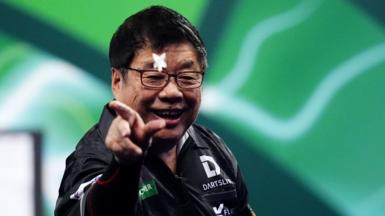 Paul Lim celebrates a win at the PDC World Championship