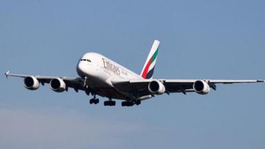 An Emirates aircraft in the sky