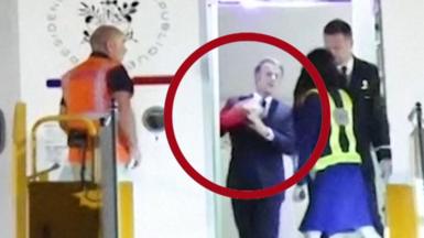 Image shows moment Macron is shoved in the face by his wife