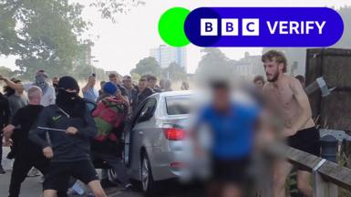 Protestors attack a car in Hull