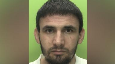 Custody photo of man with beard