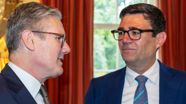 Prime Minister Sir Keir Starmer and Greater Manchester Mayor Andy Burnham speaking at an event.
