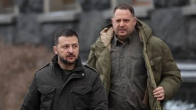 Zelensky and Yermak walking along, there's snow on the ground behind them