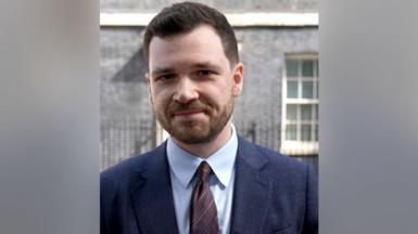 Zeffman standing outside No 10 as he looks into the camera