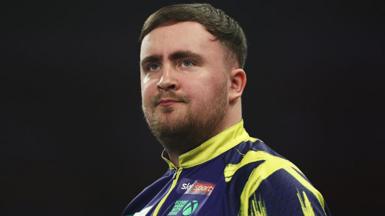 Luke Littler looks pensive during his Bahrain Masters defeat by Gerwyn Price