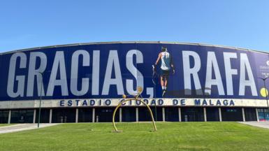 A giant banner bearing the slogan 'Gracias Rafa' has been erected at the Palacio de Deportes in Malaga