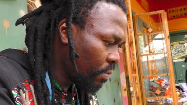 A close up shot of Ugandan designer Latif Madoi's face