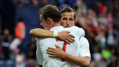 Harry Kane (facing camera) and Will Keane