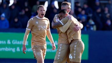 Ashley Charles is congratulated by Mitch Pinnock after scoring for Bromley