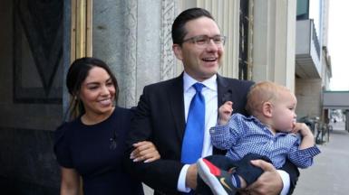 Canadian Conservative Party leader Pierre Poilievre, wife Anaida and son Cruz arrive at the National Conservative caucus meeting on September 12, 2022 in Ottawa.