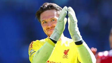 Liverpool goalkeeper Freddie Woodman applauds the crowd after the Merseyside derby