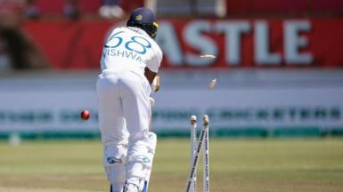 A reverse image of Vishwan Fernando being bowled out 