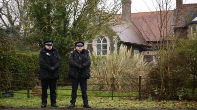 Police officers outside Wood Farm, a property on the Sandringham Estate