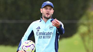 Jack Wilshere, wearing a light blue Arsenal training top, is poised to join Norwich as first team coach.