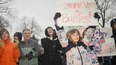 Protesters rally in support of Harvard University