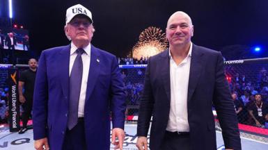 US president Donald Trump stands next to UFC president Dana White 