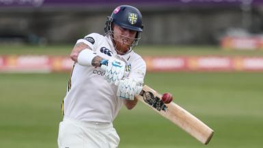 Ben Stokes, wearing a Durham batting helmet, plays a shot