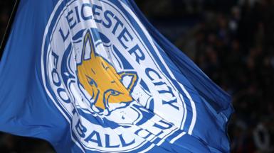 A flag with the Leicester City logo on it