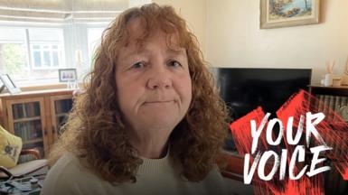 Fran Barrett, wearing a jumper in her living room in Cheshire. 
