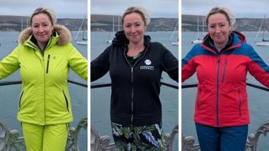 Three shots of Zoe Kleinman side-by-side. They are identical but for her clothing, with a seaside background. On the left, she is wearing a bright yellow ski suit. In the middle, a black hoodie. On the right, a red and blue jacket. It is incredibly difficult to tell which is the original.