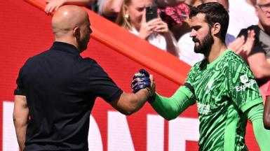 Liverpool manager Arne Slot with Alisson Becker