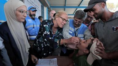 Sigrid Kaag with a group of people in Gaza