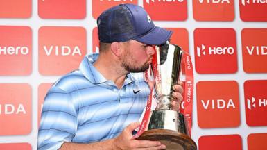 Alex Fitzpatrick kisses the Indian Open trophy
