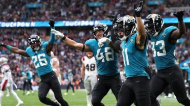 Parker Washington celebrates scoring a touchdown at Wembley with his Jacksonville Jaguars team-mates