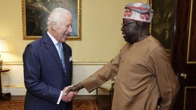 King Charles shaking hands with President Tinubu of Nigeria