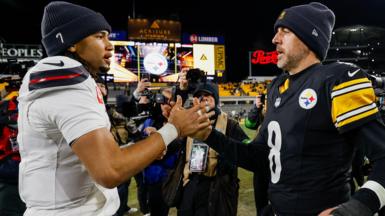 Pittsburgh Steelers quarterback Aaron Rodgers shakes hands with Houston Texans quarterback CJ Stroud after their NFL play-off game