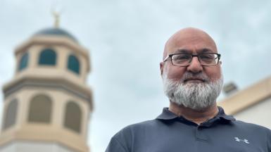Zaf Iqbal stands outside of a mosque in Sunderland