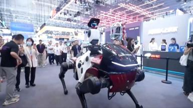 A humanoid robot riding a mechanical horse in front of onlookers