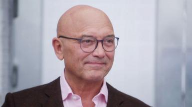 A picture of MasterChef host Gregg Wallace in a pink shirt