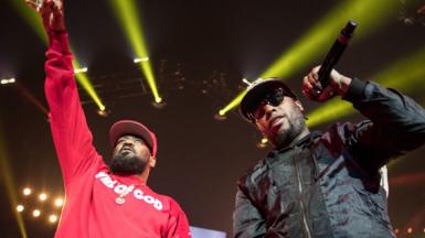 Two members of Wu Tang Clan perform on stage