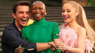 Wicked: For Good stars Jonathan Bailey, Cynthia Erivo, Ariana Grande laughing and hugging