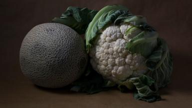 A melon and a cauliflower