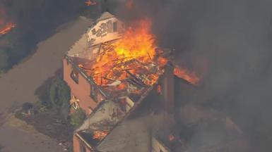 Large flames burn a home