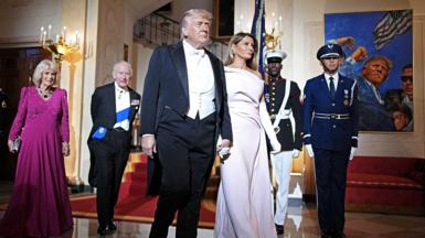 Queen Camilla, King Charles III, U.S. President Donald Trump, and First Lady Melania Trump pose at the base of the Grand Staircase during an official state dinner hosted by the President and First Lady at The White House on day two of the State Visit